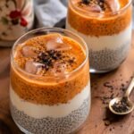 glass of chia seeds with white chocolate and coffee with chocolate crush topping.