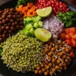 plate of sprouts including chana moong tomato coriander lemon carrot cucumber.